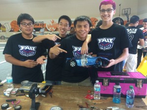 Students from FAU High School's Hydro-Nex Gen team show off their battered, but still running, #10 car after the H2AC race in Florida.